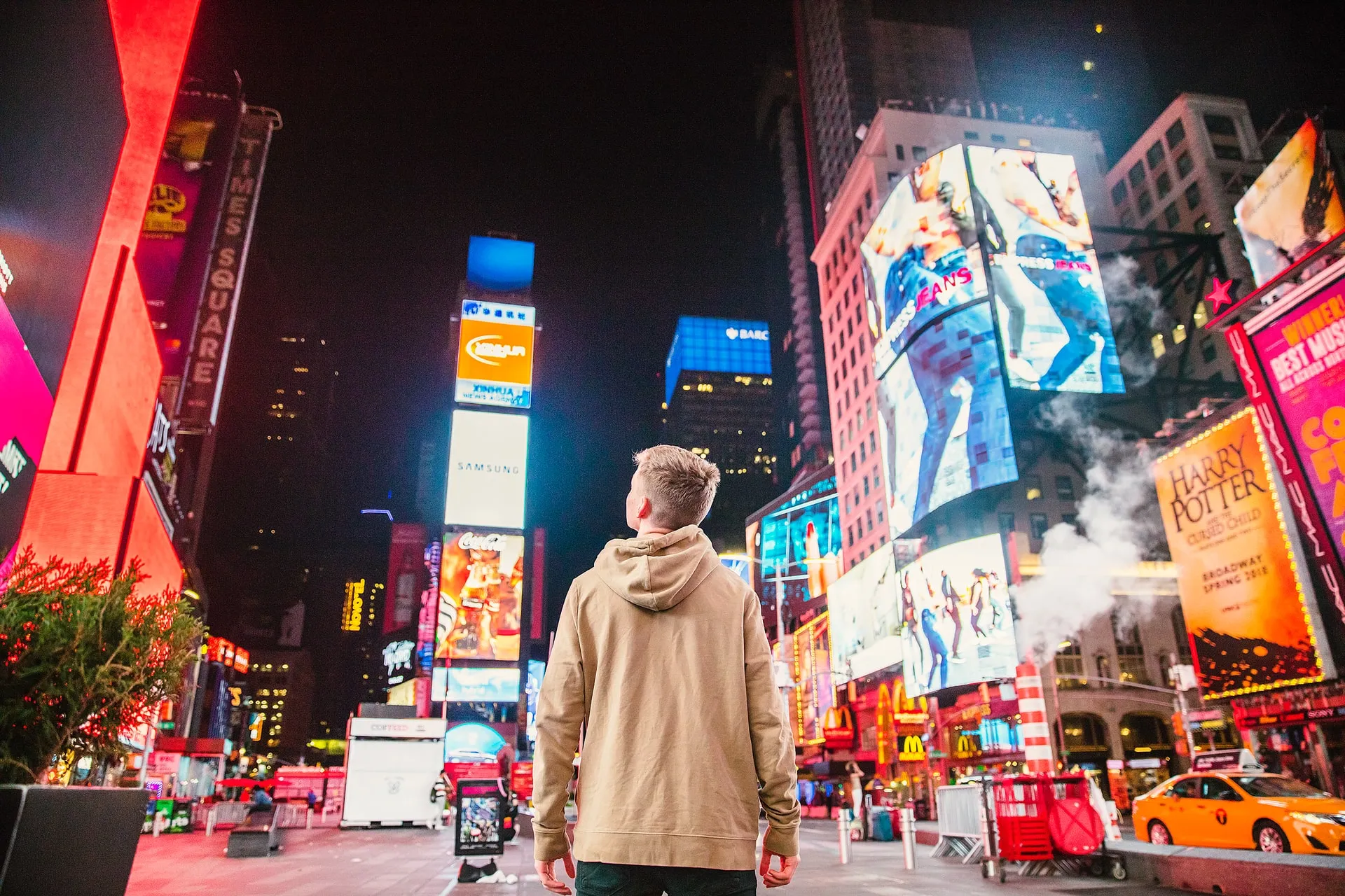 Man in New York City at night