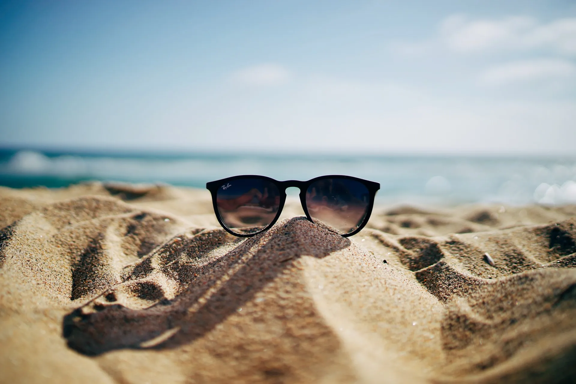 sunglasses on the beach sand