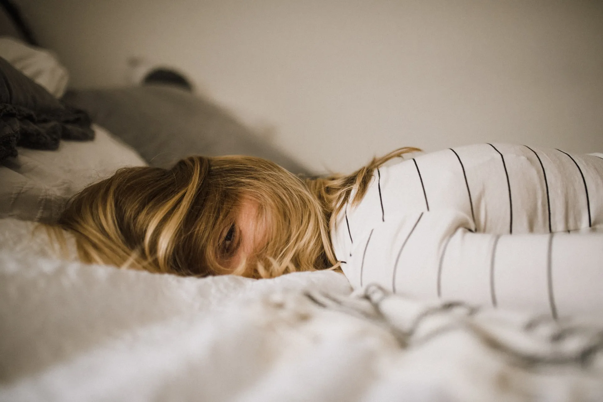 Woman sleeping on a bed