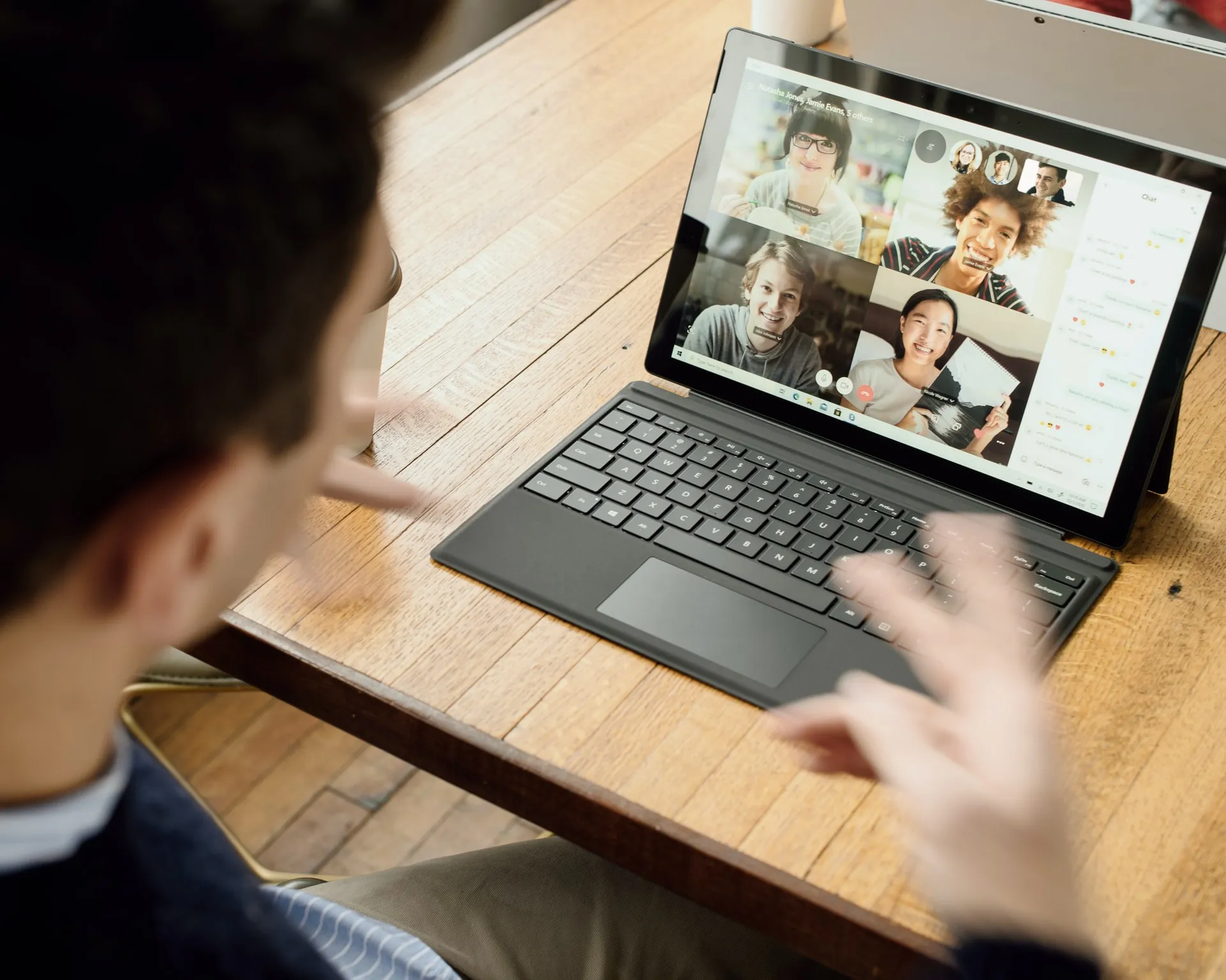 man on a virtual meeting on a laptop